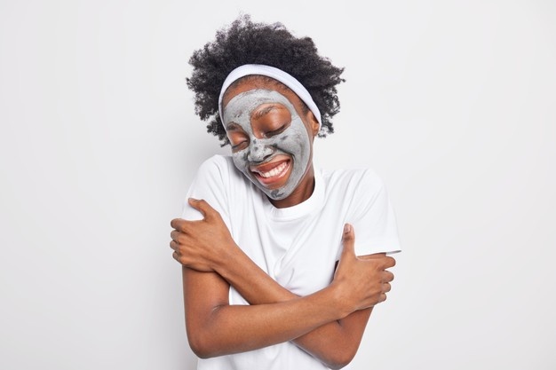 https://www.drlyndouce.com/wp-content/uploads/2021/10/waist-up-shot-happy-afro-american-woman-embraces-herself-recalls-nice-memories-keeps-eyes-shut-applies-clay-moisturizing-mask-skin-care_273609-52060.jpg